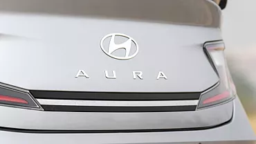 aura exterior rear badge